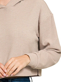 Ribbed Crop Hoodie in Being showing the drop-shoulder and oversized fit on a model.