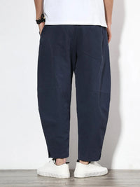 Plus size men's relaxed fit pants showing multiple pockets and style