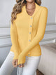 Women's asymmetrical ribbed button up cardigan in yellow, cozy chic style.