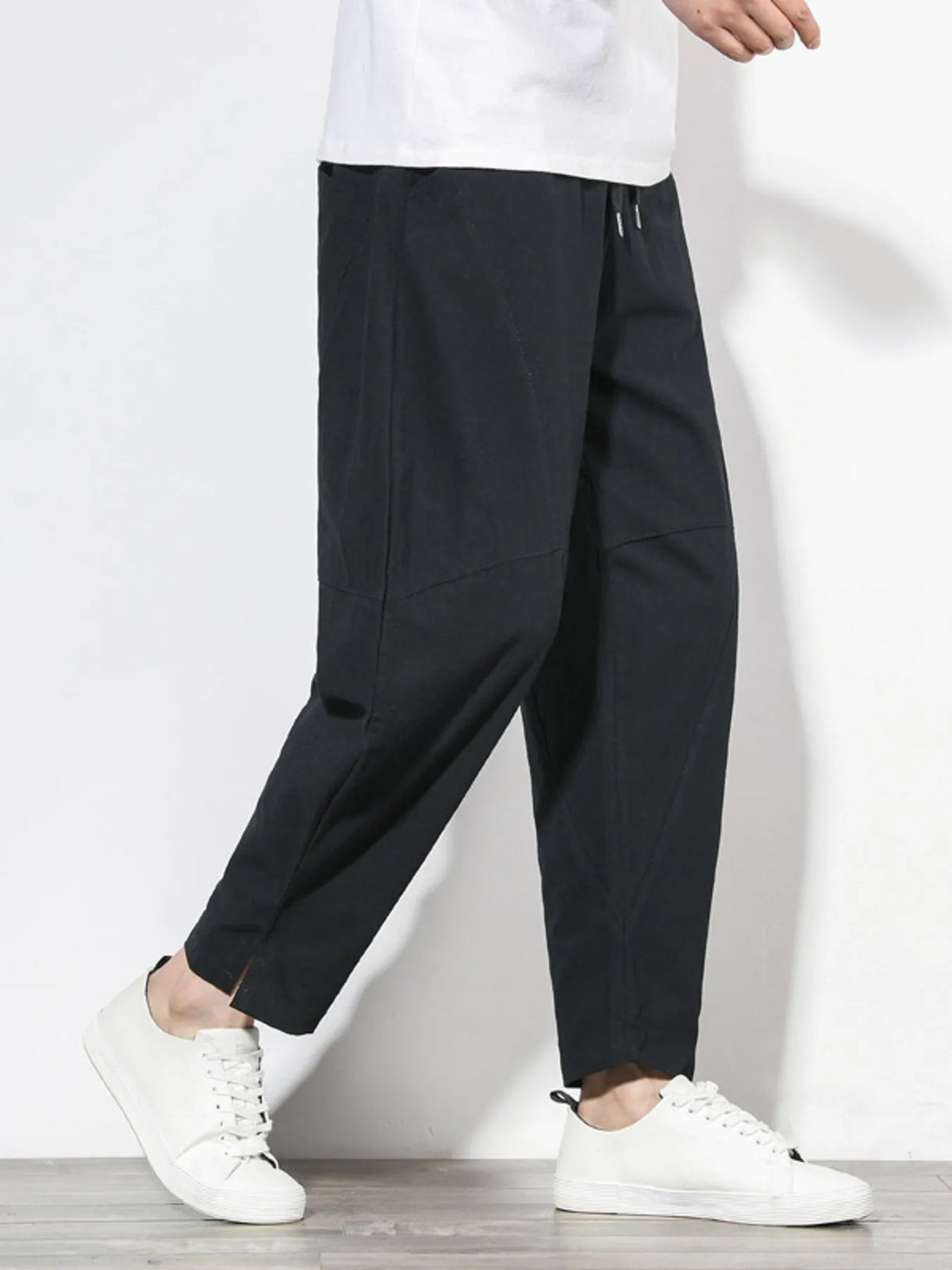 Plus size men's relaxed fit pants showing multiple pockets and style
