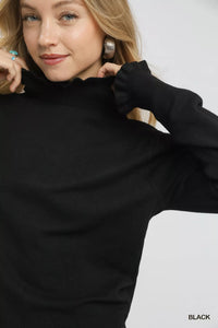 Puff Sleeve Sweater with Ruffle Detail and Mock Neck shown in Black on a model.