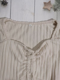 Women’s ruched drawstring ribbed long sleeve top in beige, styled with jeans for casual fall outfit