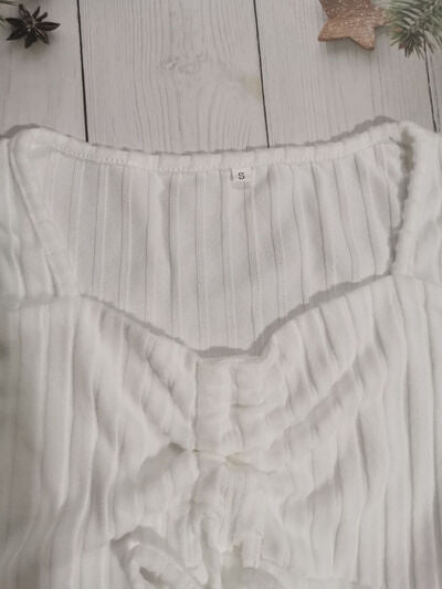 Women’s ruched drawstring ribbed long sleeve top in beige, styled with jeans for casual fall outfit