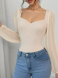 Women's sweetheart neck balloon sleeve bodysuit outfit, Apricot, styled with jeans.