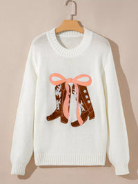 Women's Embroidered Bow Boots Drop Shoulder Sweater in cream, laid flat showing the detailed boot and bow design on the front.