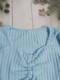 Women’s ruched drawstring ribbed long sleeve top in beige, styled with jeans for casual fall outfit