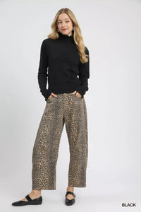 Puff Sleeve Sweater with Ruffle Detail and Mock Neck shown in Black on a model.