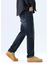 Men's washed blue straight leg jeans, regular fit, stretch denim