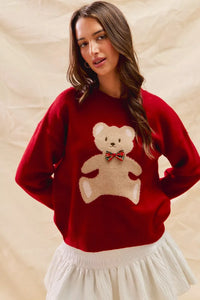 Cozy Teddy Bear Christmas Sweater with red check ribbon and festive holiday design on a soft women's pullover.