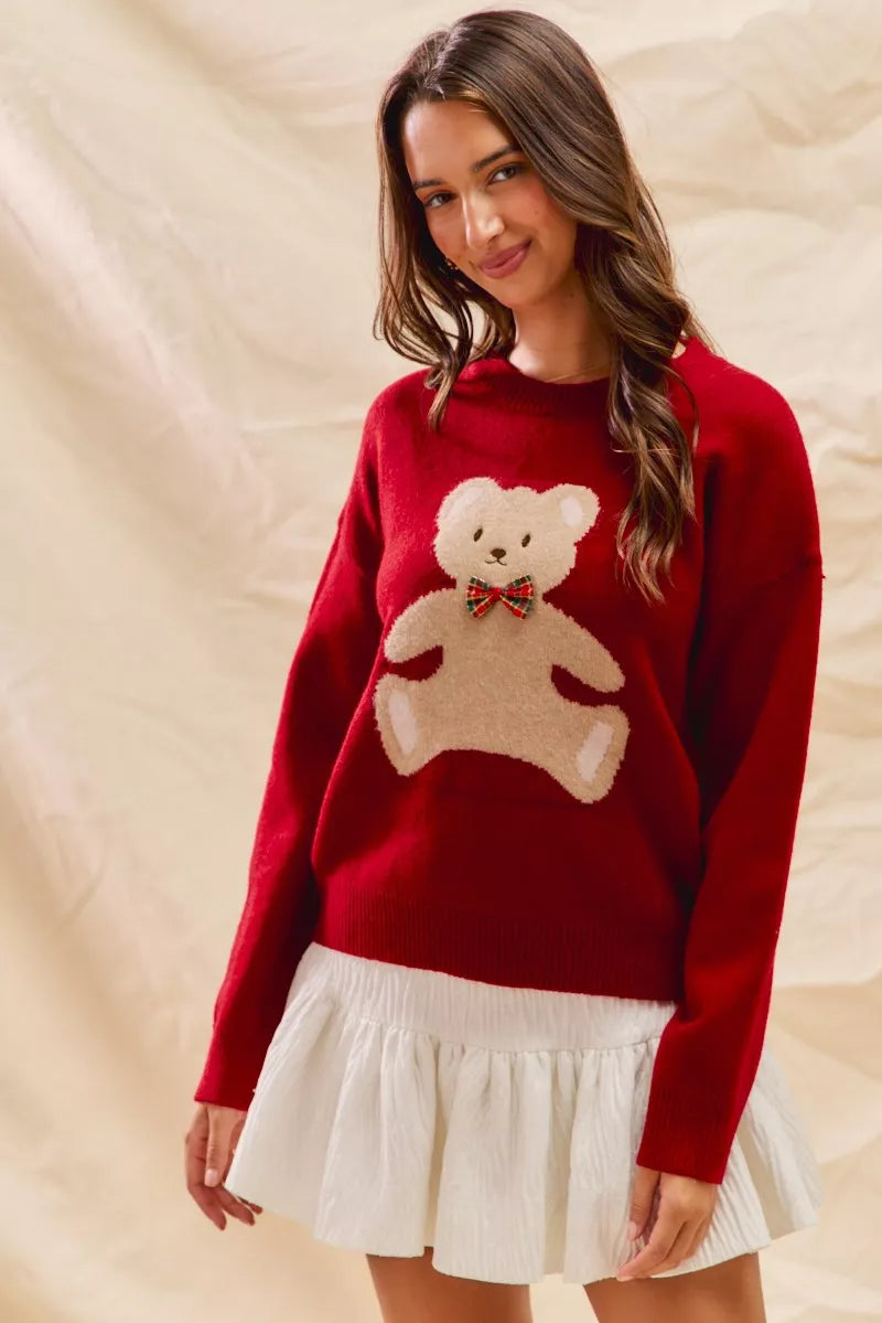 Cozy Teddy Bear Christmas Sweater with red check ribbon and festive holiday design on a soft women's pullover.
