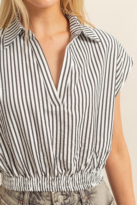 Striped Elastic Hem Blouse with Johnny collar and cap sleeves on a mannequin.
