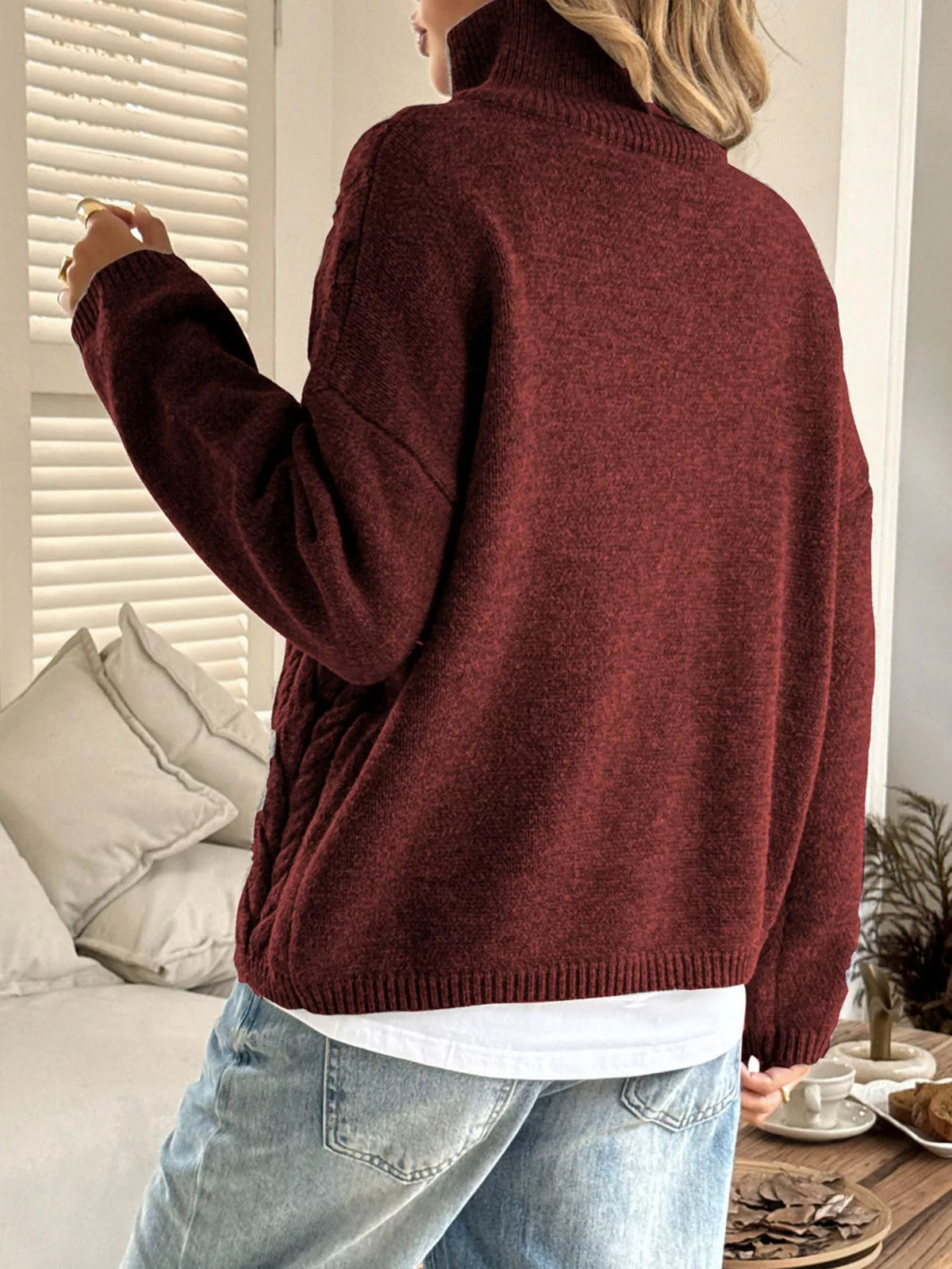 Women's Cable Knit Zip Neck Sweater in burgundy worn with boots