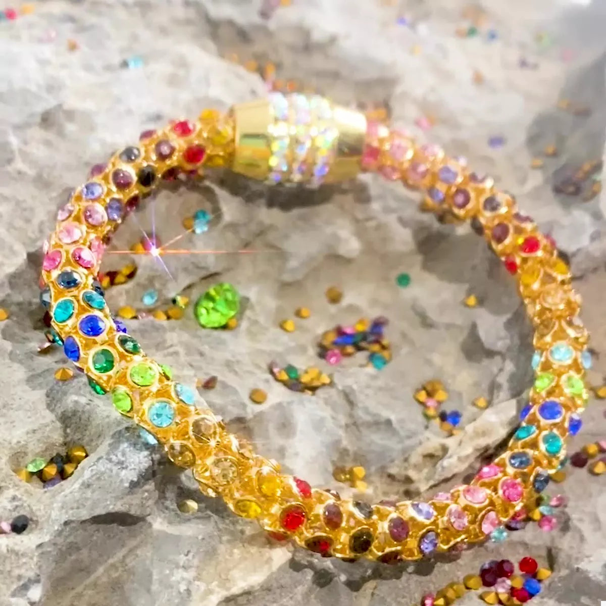 Rainbow Crystal Bracelet showcasing dainty gold chain with multicolored crystals.