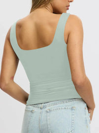 Breathable sleeveless blouse for women, cropped fit, perfect for layering under cardigans or jackets.
