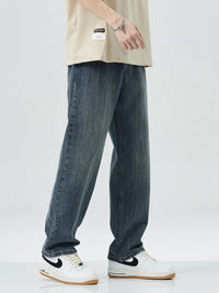 Men's washed wide leg relaxed fit jeans front view laid flat