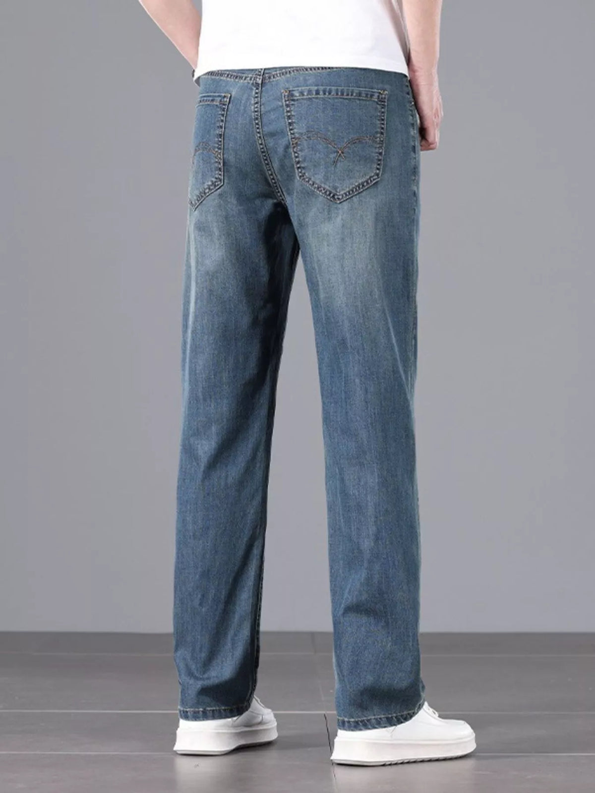Men's straight fit jeans in a dark wash.