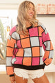 Oversized Color Block Sweater in bold red and cream colors on a model.