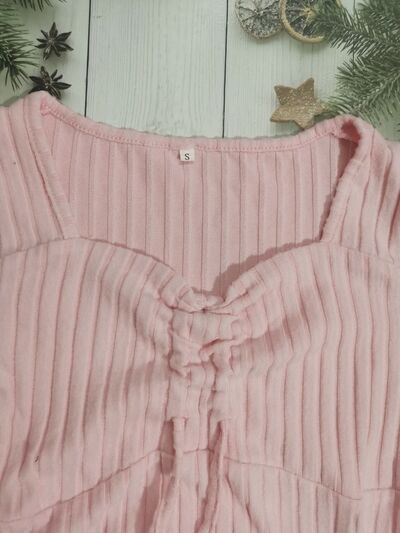 Women’s ruched drawstring ribbed long sleeve top in beige, styled with jeans for casual fall outfit