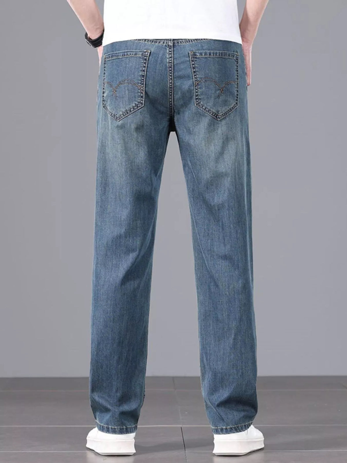 Men's straight fit jeans in a dark wash.