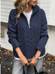 Women's Cable Knit Zip Neck Sweater in Navy worn with boots