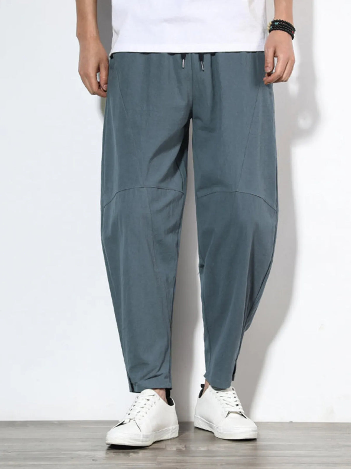 Plus size men's relaxed fit pants showing multiple pockets and style