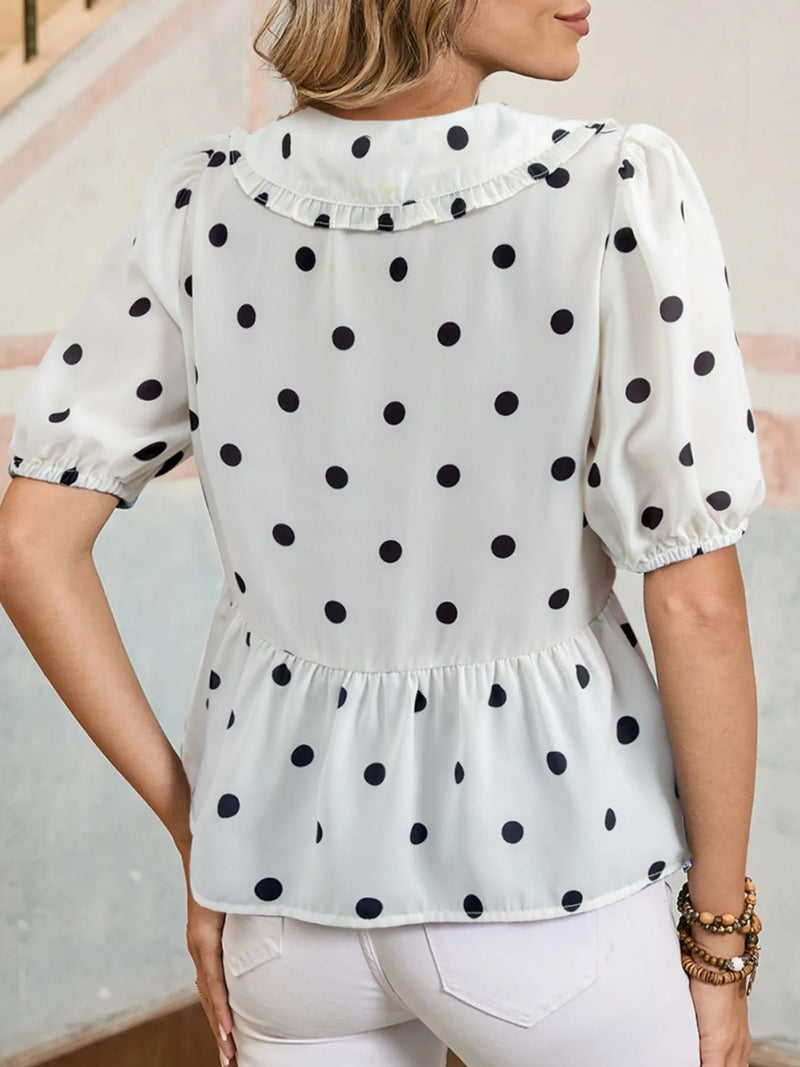 Polka Dot Puff Sleeve Top in black and white worn with denim jeans