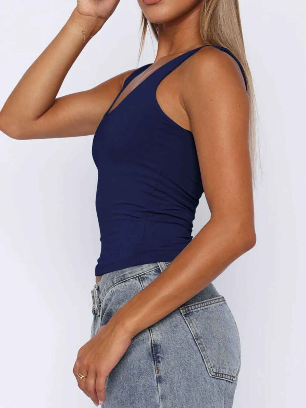 Breathable sleeveless blouse for women, cropped fit, perfect for layering under cardigans or jackets.