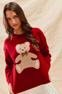 Cozy Teddy Bear Christmas Sweater with red check ribbon and festive holiday design on a soft women's pullover.