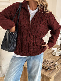 Women's Cable Knit Zip Neck Sweater in burgundy worn with boots