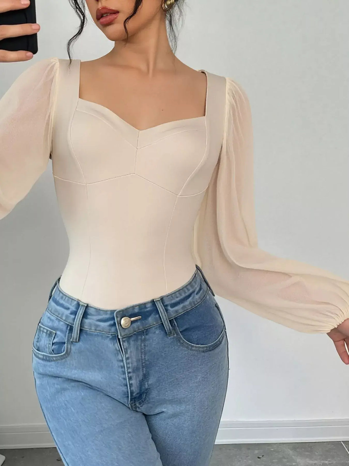 Women's sweetheart neck balloon sleeve bodysuit outfit, Apricot, styled with jeans.