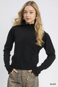 Puff Sleeve Sweater with Ruffle Detail and Mock Neck shown in Black on a model.