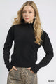 Puff Sleeve Sweater with Ruffle Detail and Mock Neck shown in Black on a model.