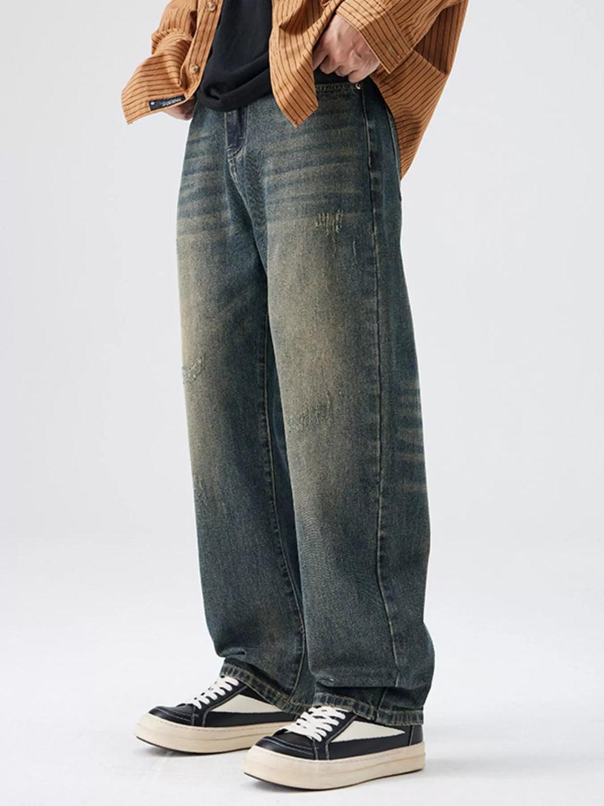 Men's Washed Wide Leg Jeans - Front view showing relaxed fit and light blue wash on a model.