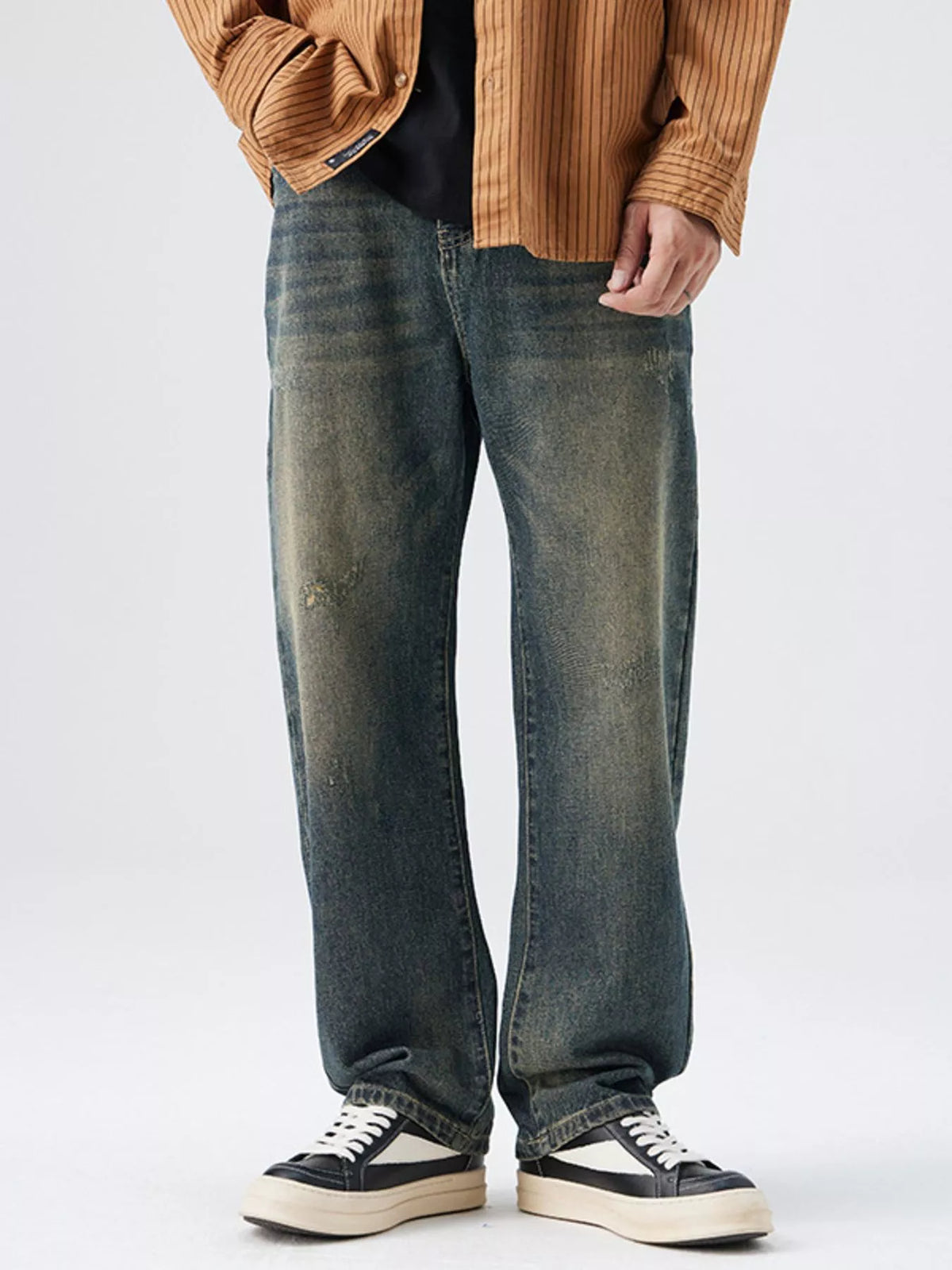 Men's Washed Wide Leg Jeans - Front view showing relaxed fit and light blue wash on a model.