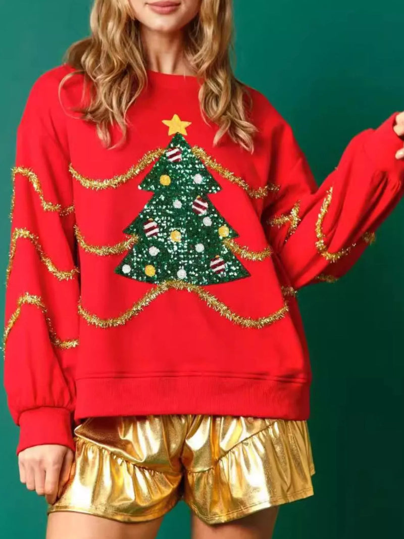 Sparkle Christmas Tree Sweatshirt on a model against a festive background.
