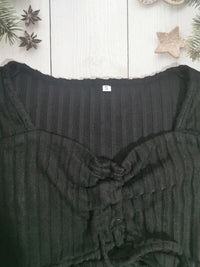 Women’s ruched drawstring ribbed long sleeve top in beige, styled with jeans for casual fall outfit