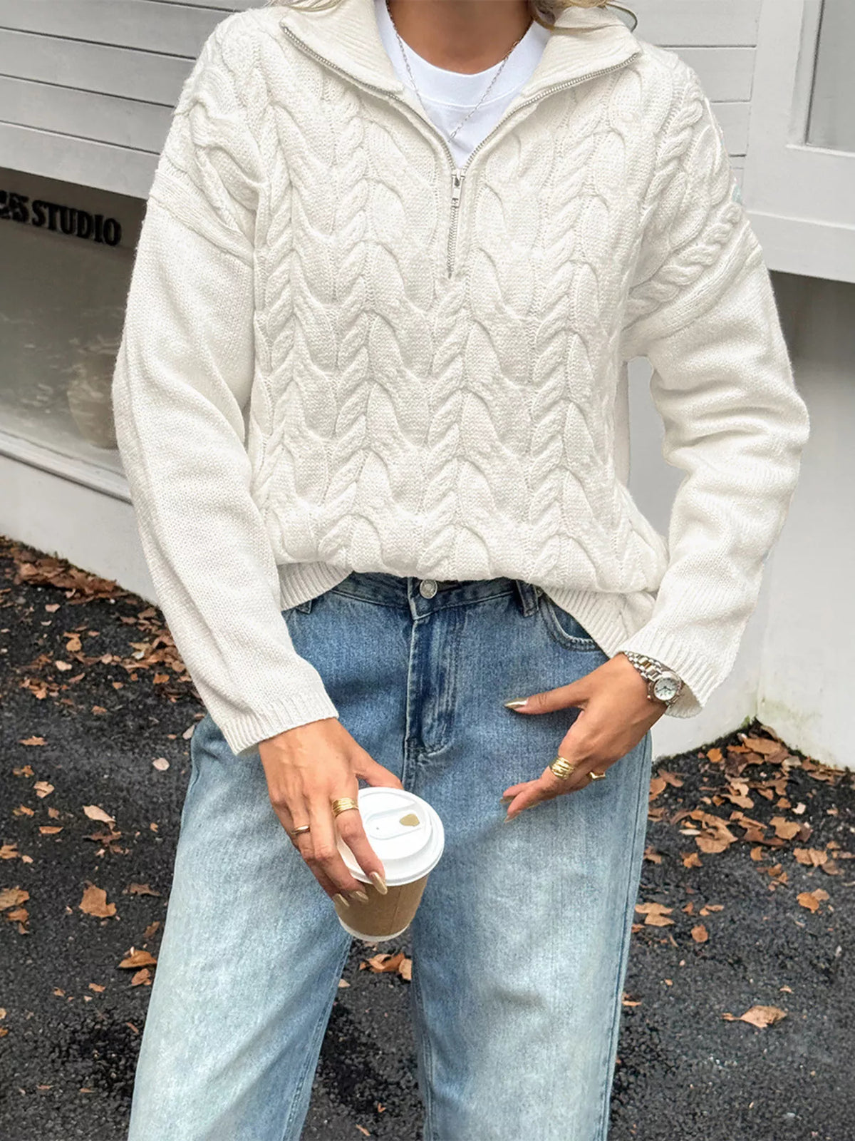 Women's Cable Knit Zip Neck Sweater in White worn with boots