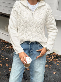 Women's Cable Knit Zip Neck Sweater in White worn with boots