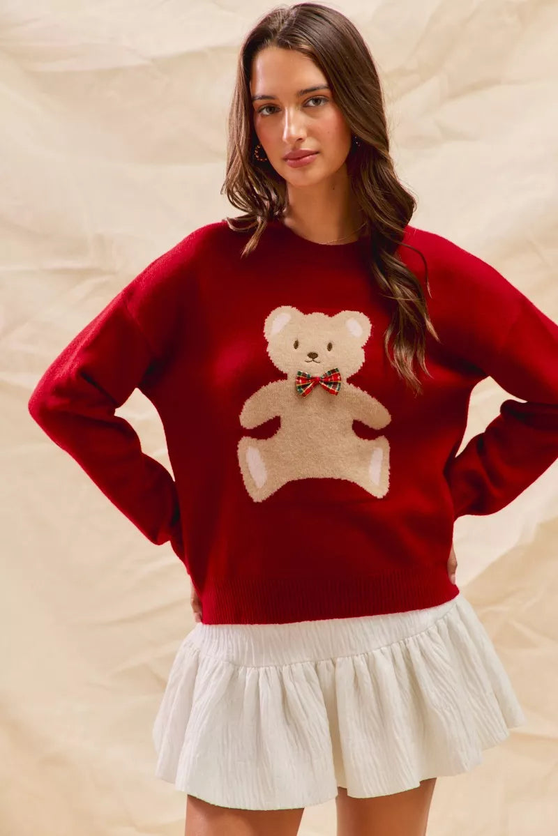 Cozy Teddy Bear Christmas Sweater with red check ribbon and festive holiday design on a soft women's pullover.