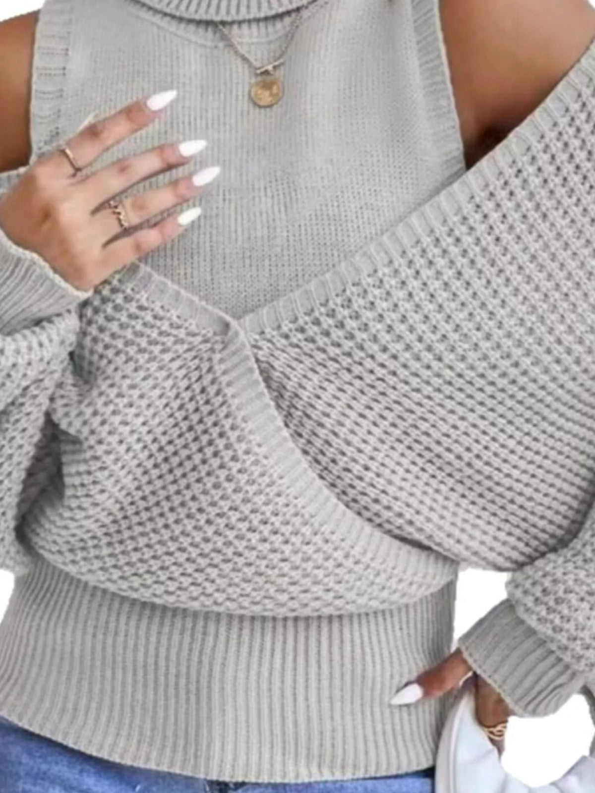 Oversized Cold Shoulder Sweater in Gray knit worn with denim jeans.