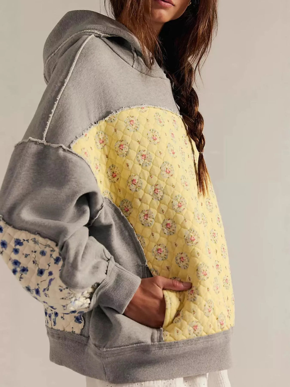 Women's Dropped Shoulder Hoodie in gray, showing the front pocket and oversized fit on a model.