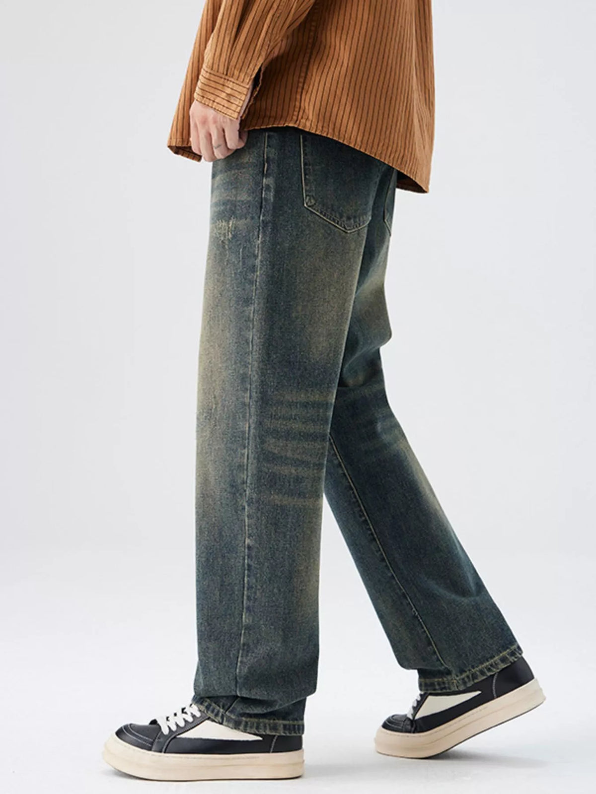 Men's Washed Wide Leg Jeans - Front view showing relaxed fit and light blue wash on a model.