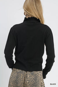 Puff Sleeve Sweater with Ruffle Detail and Mock Neck shown in Black on a model.