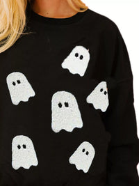 Spooky Halloween Sequin Sweatshirt showing the reversible design from black with orange sequins to orange with black sequins.