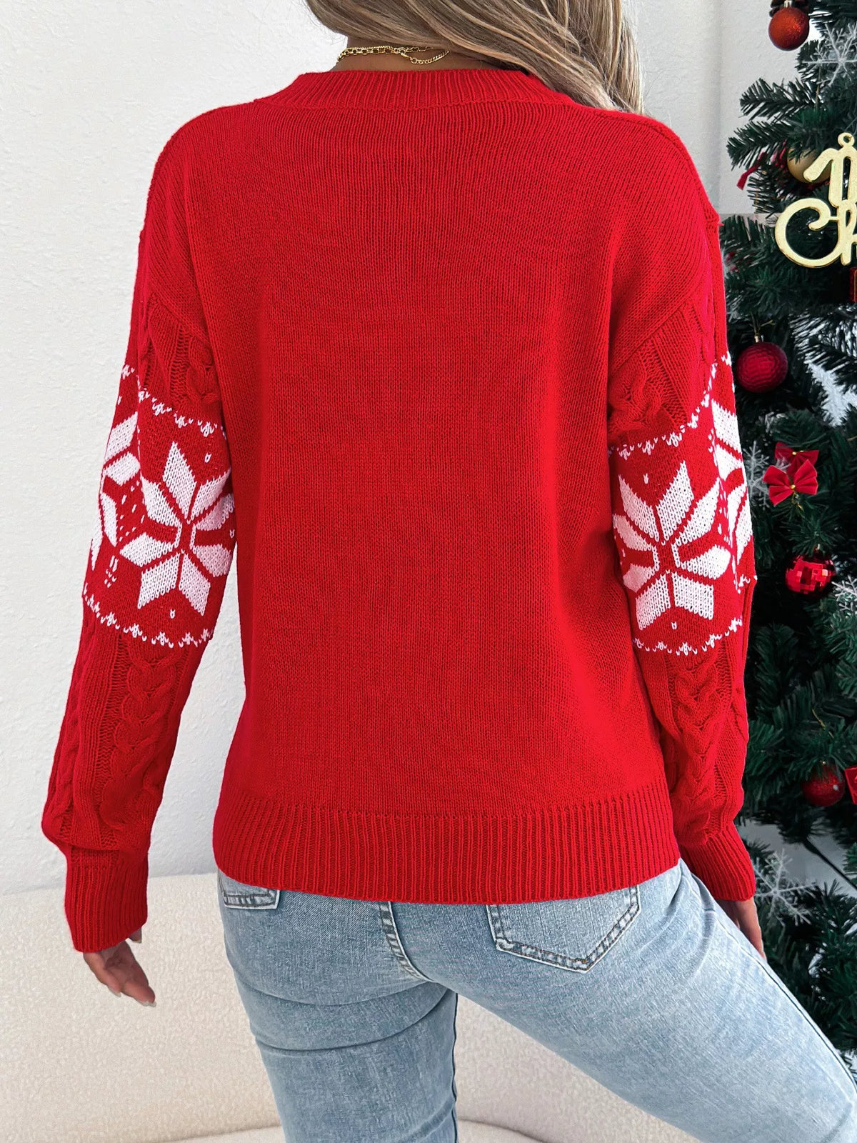 Women's Christmas Cable Knit Sweater with a close-up of the festive snowflake and cable knit pattern.