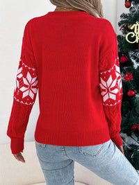 Women's Christmas Cable Knit Sweater with a close-up of the festive snowflake and cable knit pattern.