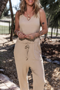 Front view of the wide-leg jumpsuit with adjustable straps and drawstring waist