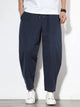 Plus size men's relaxed fit pants showing multiple pockets and style