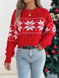 Women's Christmas Cable Knit Sweater with a close-up of the festive snowflake and cable knit pattern.