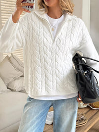 Women's Cable Knit Zip Neck Sweater in White worn with boots